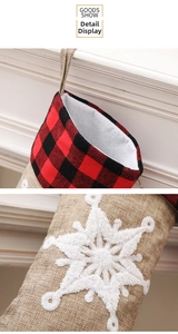 Detailed view of buffalo plaid Christmas stocking with 3D plush snowflake embroidery