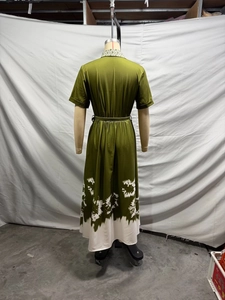 Back view of a green French elegant midi dress with white tie-dye floral print and waist belt