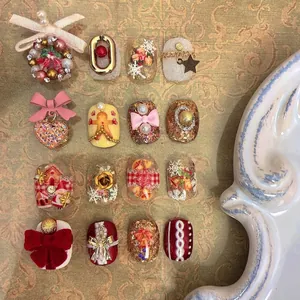 3D Christmas nail art stickers with gingerbread men, snowflakes, and velvet bows