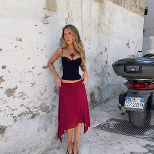 Chic black lace trim corset top paired with a wine red irregular knit midi skirt set
