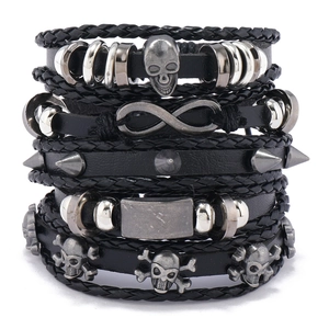 Men's leather woven bracelet set with skull and infinity charms in punk style