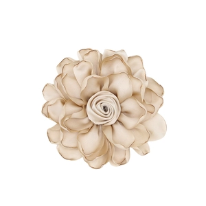 Detail of champagne satin fabric flower with delicate stitched edges for DIY accessories