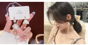 Detail of S925 silver needle pearl tassel earrings with long gold chain fringe for women