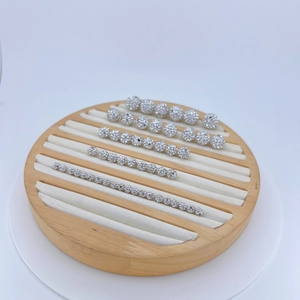 Macro view of assorted silver sparkling cubic zirconia disco beads in multiple sizes