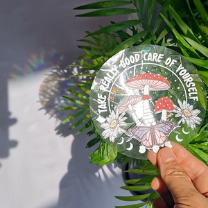 Rainbow suncatcher window sticker featuring holographic mushroom and daisy patterns