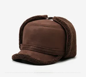 Detail of winter trapper hat showing brown suede fabric and thick fleece lining