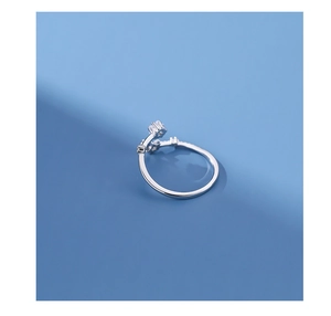 Detailed macro view of silver star ring with white zircon stones and adjustable band