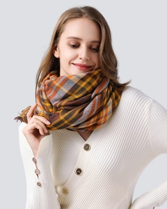 Close-up of brown, yellow and grey plaid check pattern on a woven autumn scarf