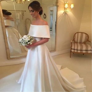 Elegant off-the-shoulder white satin wedding dress with A-line skirt and long train