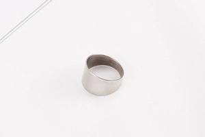 Detailed macro view of silver minimalist wide band ring showing thickness and inner texture