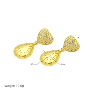 Detail showing dimensions of gold heart and teardrop earrings with cubic zirconia