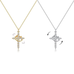Detailed close-up of rotating 18K crown cross pendants with sparkling zircon stones