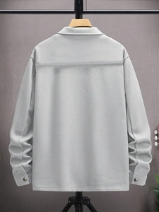 Detailed back view of a light gray men's corduroy jacket with metallic button cuffs