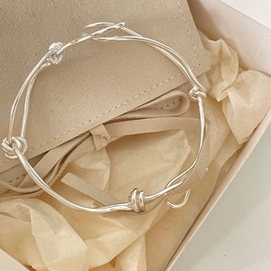 Minimalist 925 sterling silver woven knot bracelet presented in a luxury gift box