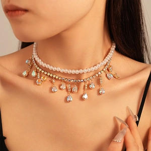 Close-up of double-layer choker with white pearls and AB crystal teardrop pendants