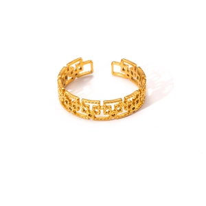 Detail of gold titanium open ring featuring a hollow geometric chain design and polished finish