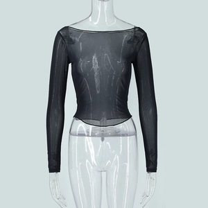 Detail of sheer black mesh fabric on long sleeve off-shoulder slim fit crop top