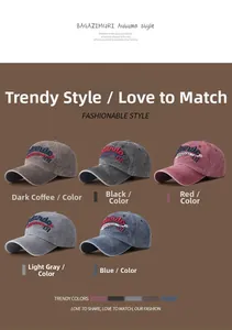 Detail view of five colors of vintage washed cotton baseball caps with Mundo 01 embroidery