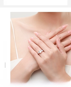 Elegant three-stone 925 silver ring featuring oval center stone and pear side gems