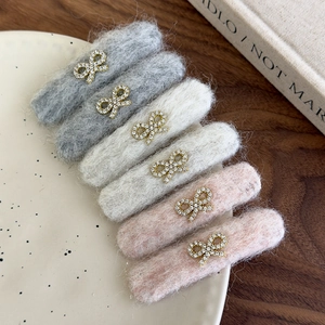 Set of 6 felt hair clips in grey, beige and pink with gold rhinestone bow detail