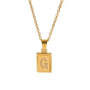 Close-up of 18k gold plated square pendant with sparkling cubic zirconia letter G