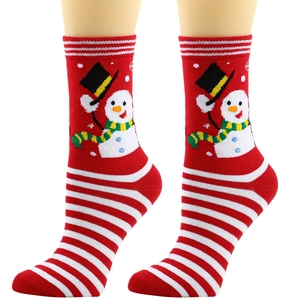 Detail of red Christmas crew socks featuring snowman pattern and red-white stripes