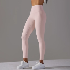Close-up of high-waisted seamless yoga leggings in soft pink with breathable texture