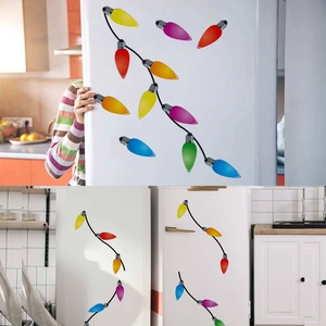 Close-up of colorful bulb-shaped magnetic stickers for festive car or fridge decoration