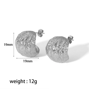 Macro shot of silver textured C-shape earrings showing 19mm size and 12g weight specs