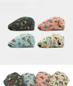 Detailed embroidery view of butterfly jacquard beret hats in four different vintage colors