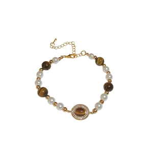 Bracelet rétro français avec perles œil de tigre brunes et breloque ovale en cristal