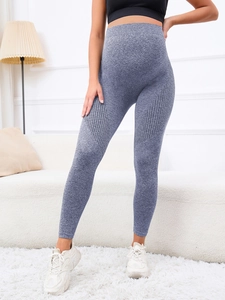 Macro detail of high-waisted seamless maternity shark leggings in heather grey fabric