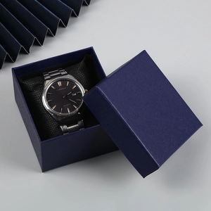 Premium navy blue square watch gift box with textured leather finish and silver watch