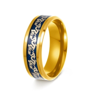 Detail shot of golden vintage dragon ring with blue enamel and silver relief patterns