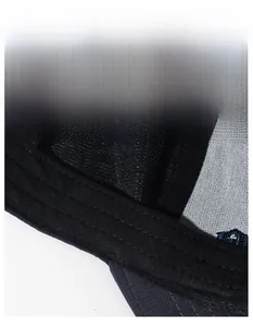 Detail of the widened moisture-wicking sweatband and stitching inside the black baseball cap