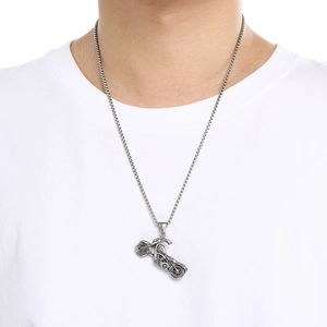 Retro punk motorcycle pendant necklace in stainless steel finish worn by a male model