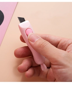 Pink rabbit-shaped mini utility knife with retractable blade for opening boxes