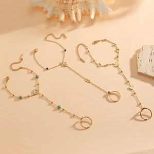 Bohemian gold ring bracelets featuring Tree of Life and Evil Eye on decorative sea shells