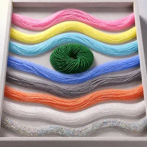 Detailed close-up of 3mm faceted natural stone beads in nine vibrant color variations