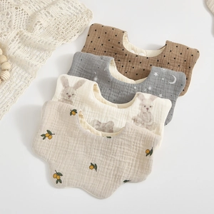 Set of 4 soft 6-layer cotton muslin flower bibs with lemon, bunny, and star patterns