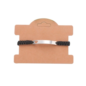 Minimalist black braided cord bracelet featuring a silver metal bar with heart cutout
