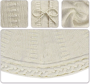 Macro view of cream knitted Christmas tree skirt featuring cable knit textures and bow details