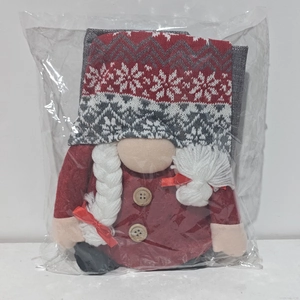 Detail of Christmas gnome chair cover with knitted hat and wooden button in packaging
