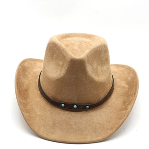 Detail of camel western cowboy hat with brown leather band and turquoise studs