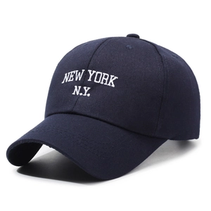 Classic navy blue cotton baseball cap with white New York embroidery on white background
