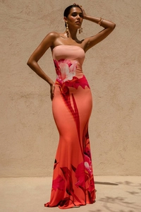 Detail view of floral tube maxi dress showing slim fit silhouette and orange-pink fabric