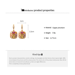 Detail view of gold-plated hoop earrings with vibrant multi-color zircon stones