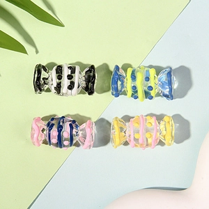 Macro shot of colorful striped glass candy beads for DIY jewelry and phone chains
