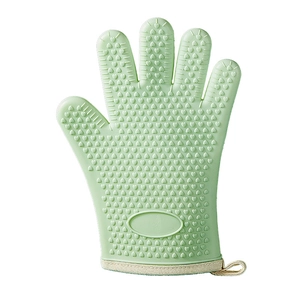 Light green silicone oven mitt with heart non-slip texture and hanging loop for kitchen use