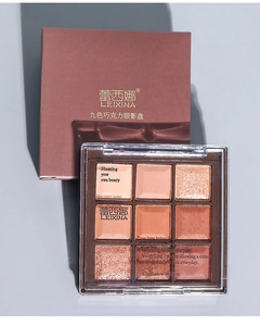 Close-up of chocolate brown nine-color eyeshadow palette with matte and shimmer textures